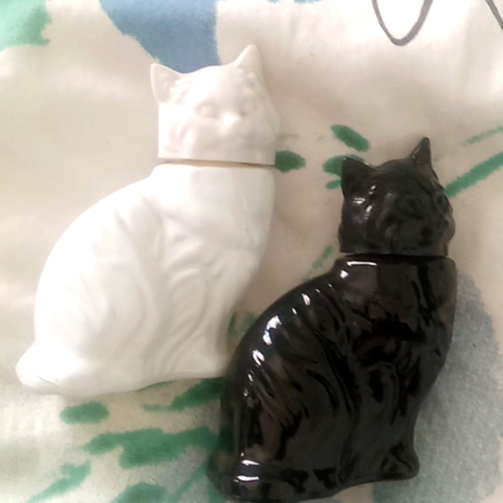 Black and white Avon kitty perfume jugs